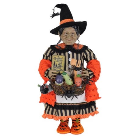Karen Didion Tillie the Kitchen Witch 22-inch Halloween figurine with orange and black clothing, vegetable basket, whisk, wooden spoon, and spellbook