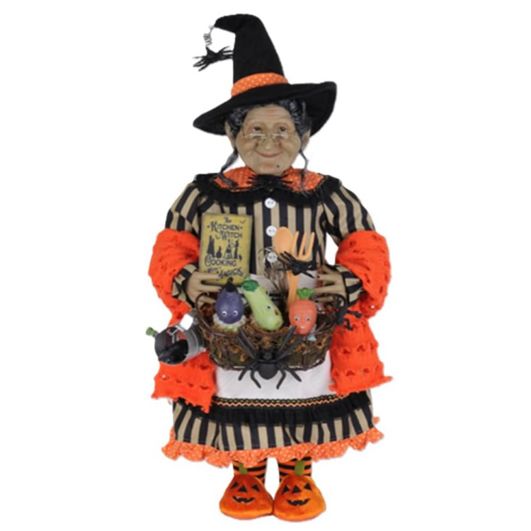 Karen Didion Tillie the Kitchen Witch 22-inch Halloween figurine with orange and black clothing, vegetable basket, whisk, wooden spoon, and spellbook