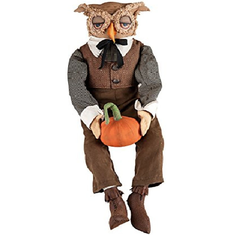 Owl figure wearing brown tween vest, brown pants and a long sleever shirt. he has a bow tied around i=his nect, brown boots and he carries a pumpkin.