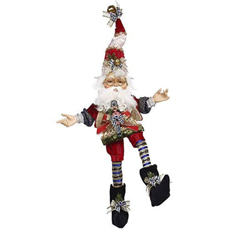 Elf figure wearing a red vest and matching shorts.  Black long sleeve shirt, black booties and blue and black striped socks. Tall pointy hat in red and white.  Lots of bows.