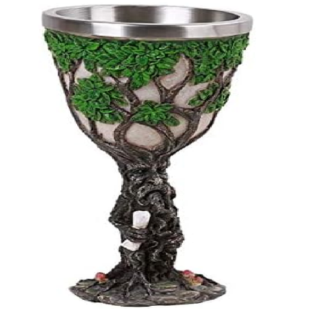 goblet shaped like a tree, with an old man's face carved ino it. 