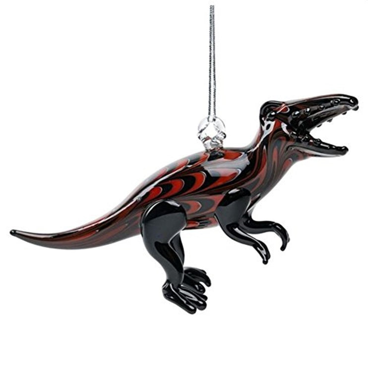 ornament in the shape of a dinosaur standing up on 2 legs. The glass is black with red swirl accents. 