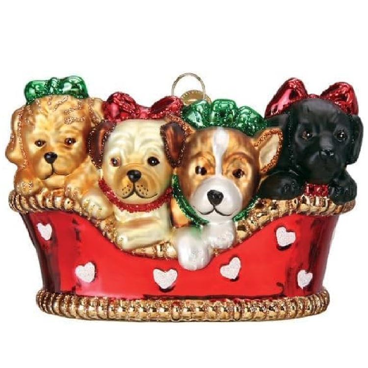 blown glass ornament depicting 4 puppies in a red basket.