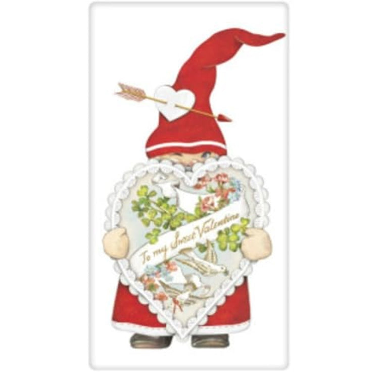 White kitchen towel with a Gnome holding a heart shaped box if choclates.