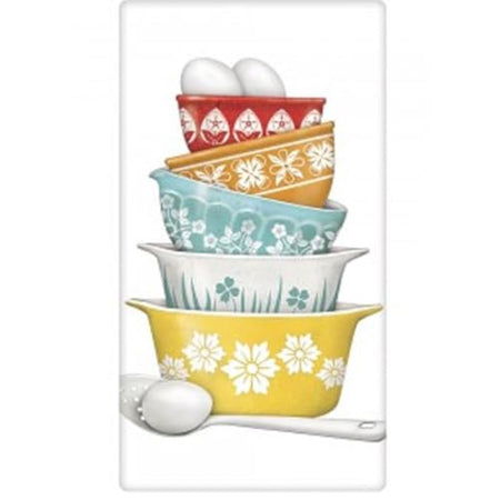 White kitchen towel with stacked vintage dishes.