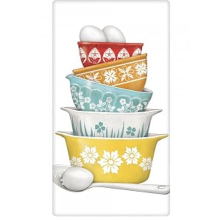 White kitchen towel with stacked vintage dishes.