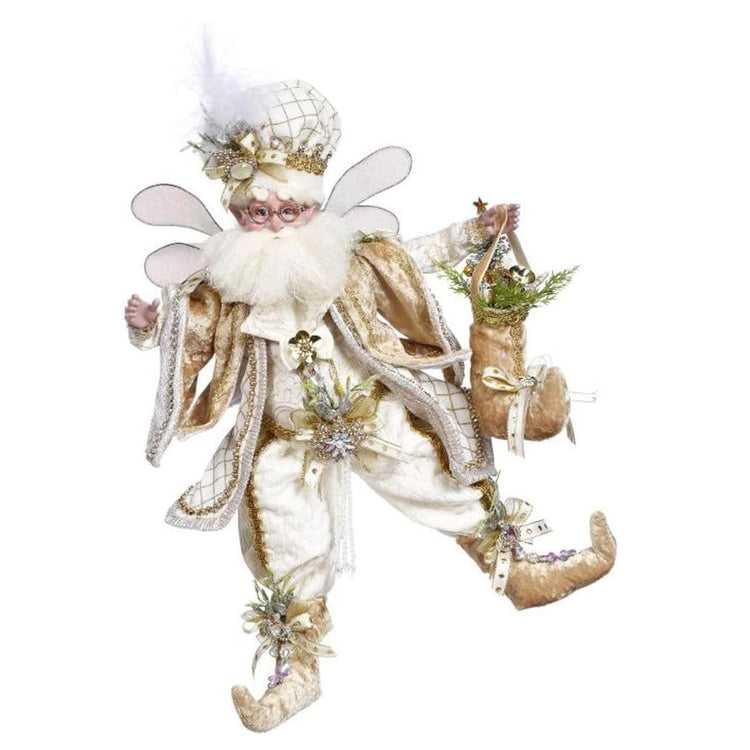 bearded fairy wearing white and gold outfit.  He's holding a golden stocking.