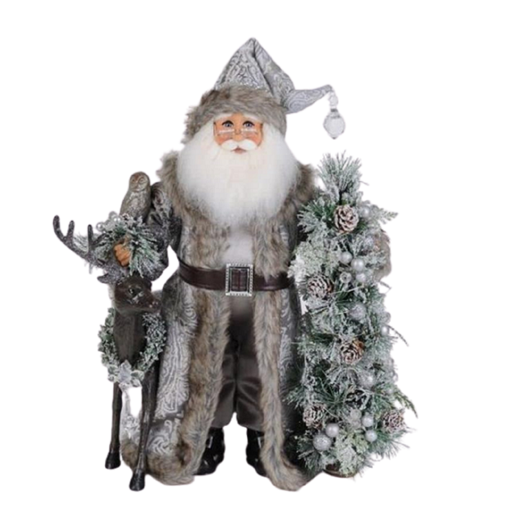 Santa in brown and grey long coat and matching hat, both trimmed in brown fur, he's got a fir tree with pinecones on one side and a black reindeer on the other.