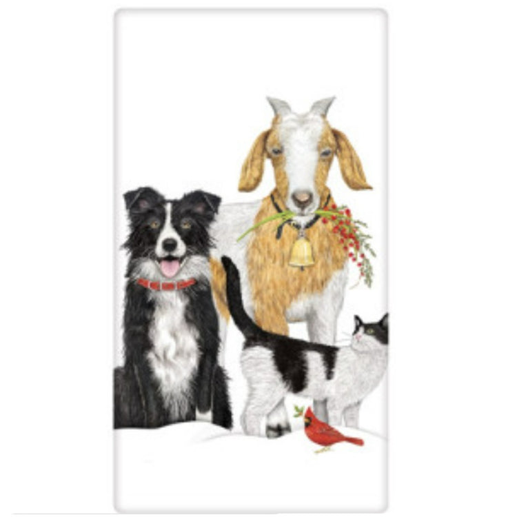 Folded white kitchen towel with a dog, goat, cat and red cardinal.