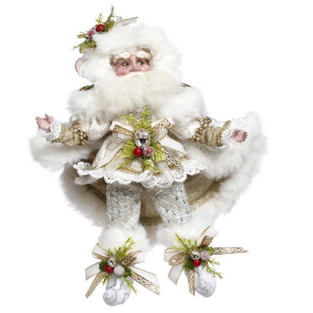 Decorative figure of a bearded fairy in white suit with greenery and red berries on a white background