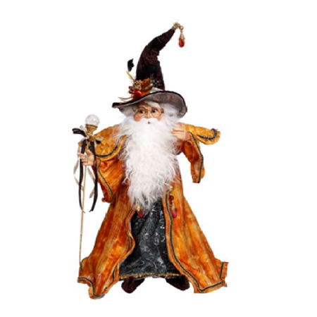 Wizard figurine with an orange robe and black hat on a white background