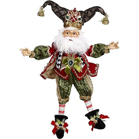 Elf figure with a two pointed hat like a jester hat with bells on the ends. He wears bloomers and a puffy sleeve shirt in green with a red fest and jacked. Black booties.