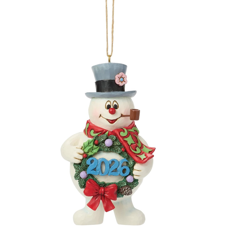 Christmas ornament of a snowman with a top hat holding a wreath displaying '2026'.