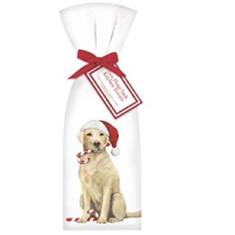 White kitchen towel folded and tied with a ribbon.  Print is a yellow lab wearing a Santa hat and carrying a candy cane in his mouth and another at his feet.
