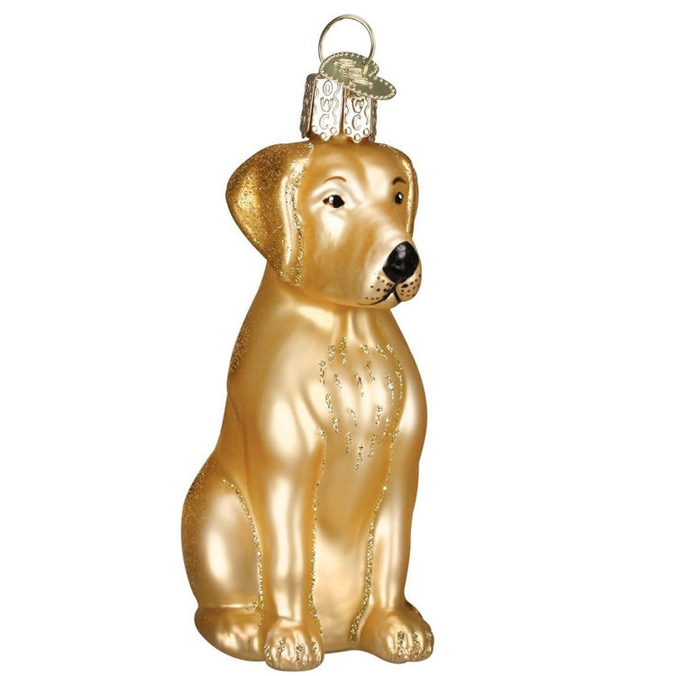 Blown glass hanging ornament shaped to look like a yellow labrador retriever, sitting down.