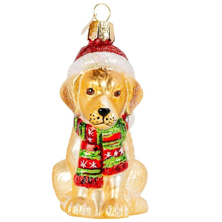 blown glass yellow labrador puppy ornament, he has on a santa hat and a green and red striped scarf