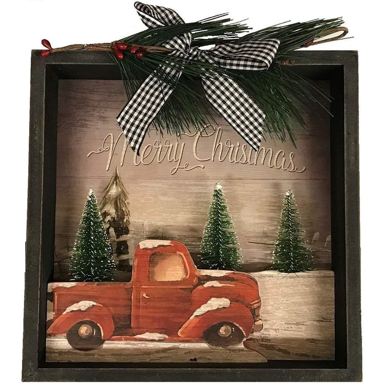 Black Shadow box 8" x 8". Red Truch sitting by pine trees. says Merry Christmas