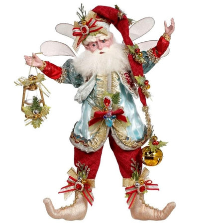 Bearded fairy in red pants, a very long red stocking cap with a large jingle bell at the end, and a light blue vest. He's holding a lantern.
