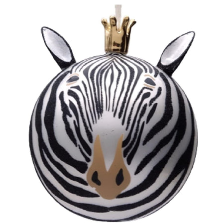 Zebra design ornament in black and white with a tan nose. The ornament is round but has added ears and a gold crown shape for the hanger attachment