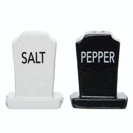 White headstone that says salt, black headstone that says pepper.