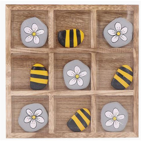 square wooden game board for tic  tac toe, 5 grey and white flower pieces and 5 yellow and black bee pieces.