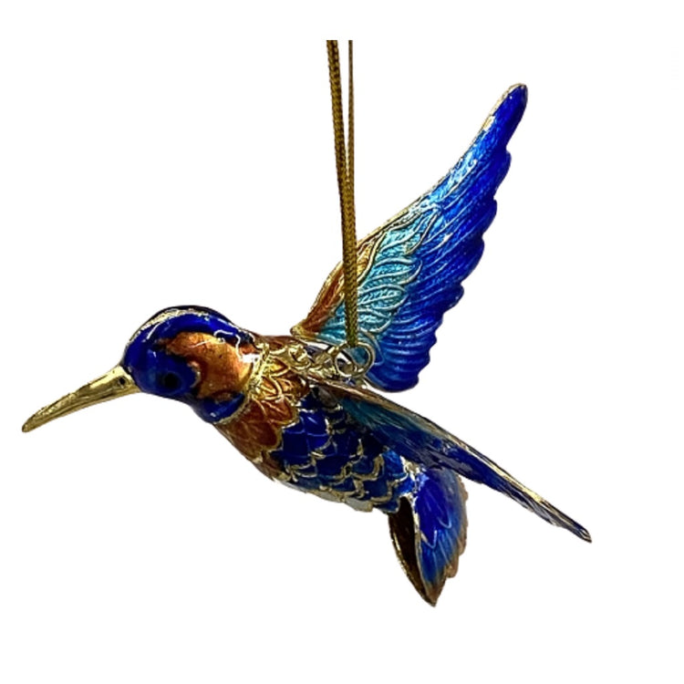 Hummingbird ornament with a gold cord.  Gold beak and gold accent with blue, teal and copper colors.  Full flight pose.