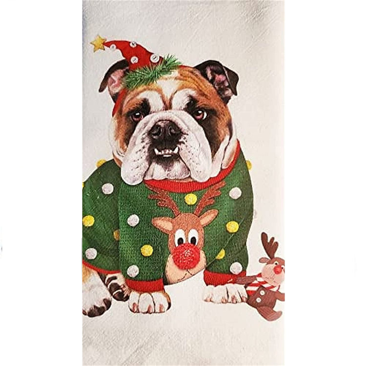 Bulldog wearing a green sweater with polka dots and Rudolph with red nose. He is also wearing  red pointy hat and has a reindeer dog toy at his feet.