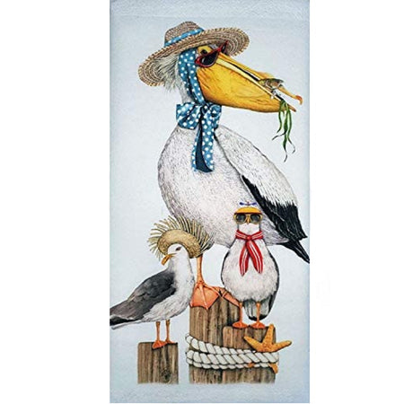 White dish towel with pelican on piling. Pelican is wearing a straw hat with sea grass in his beak.  Also shows 2 pelicans on pilings one wears a straw hat and another a hat with scarf.