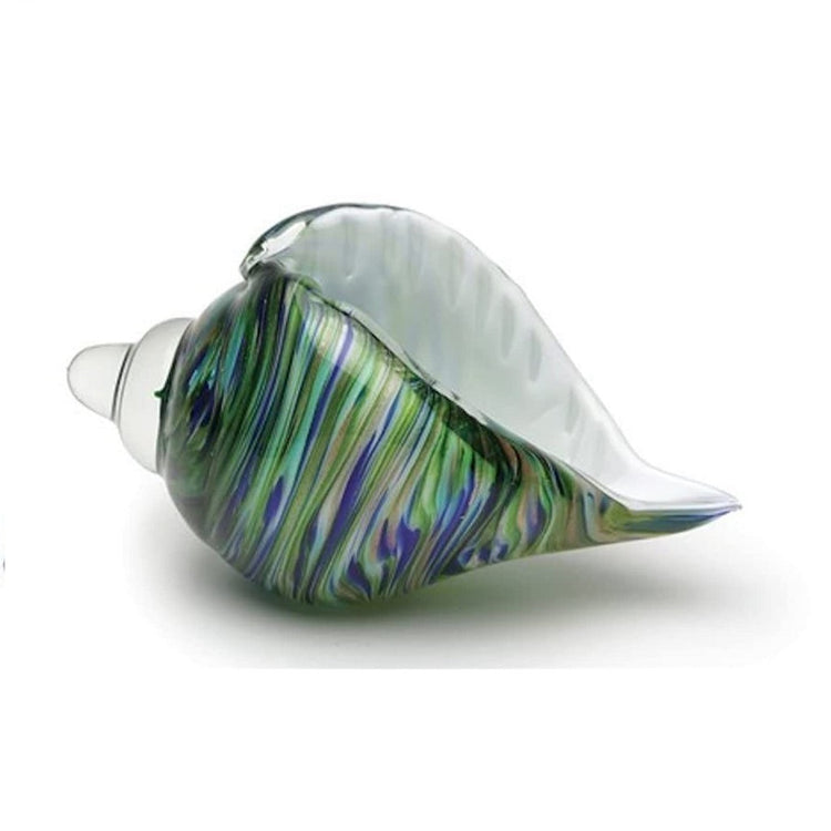 Side view of glass seashell with white inside and blue green swirl pattern outside.