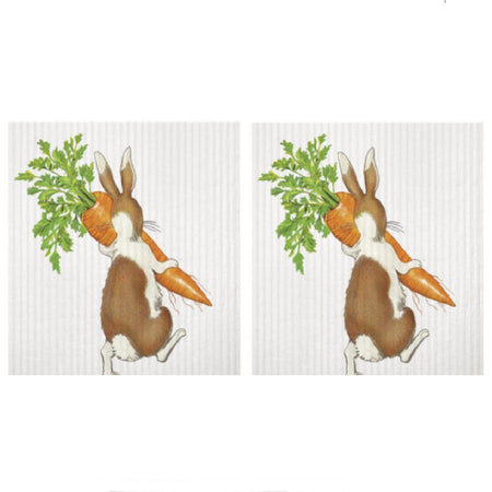 2 identical off white sponge cloths. Design is a brown and white rabbit walking away carrying a large carrot.