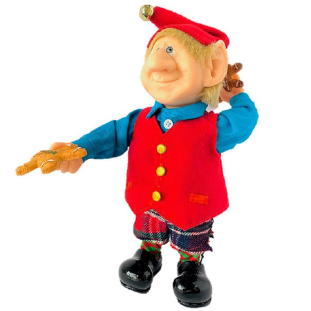 Standing Elf figuring.  He wears a red vest, blue shirt and red cap.  Pants are buffalo check red and green with black.  He hold gingerbread cookies in both hands.