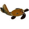 Jeweled turtle shaped box is open showing a yellow glossy inside.