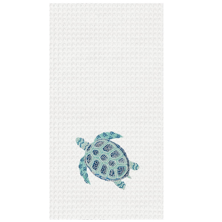 White waffle weave dish towel with blue and teal embroidered turtle on lower portion.