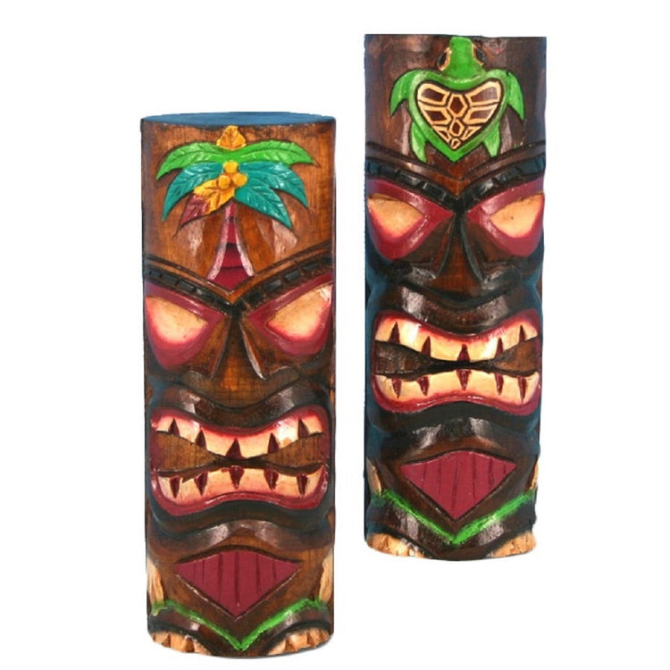 2 carved & painted tiki totems. Both have red & white faces. One has a green turtle and one has a green & blue palm tree.