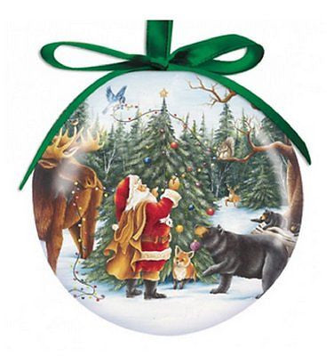 Round ball ornament with green ribbon. Santa is seen decorating tree with moose, fox, bear, squirrel and bird.