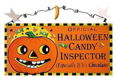 Orange wood sign. Jack-o-lantern on left. text on right "Official Halloween Candy Inspector (especially if it's chocolate)"