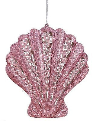 Glitter pink scallop shell ornament with silver hanger from top.