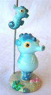 Close up view of Seahorse on the beach figure with tall metal wire.and seahorse a magnets.