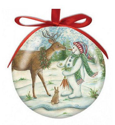 Round ball ornament with red ribbon shows deer, snowman & rabbit.