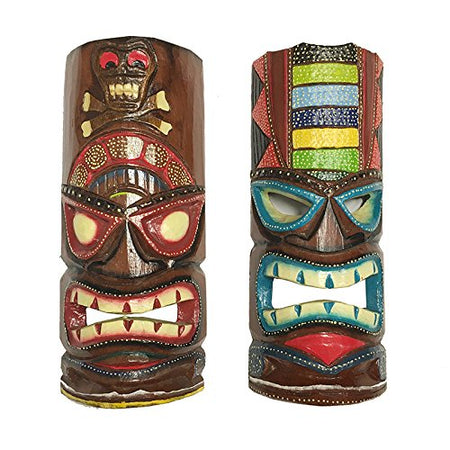 2 wood carved and painted tiki masks. One is mostly red and black, the other is mostly blues and greens.