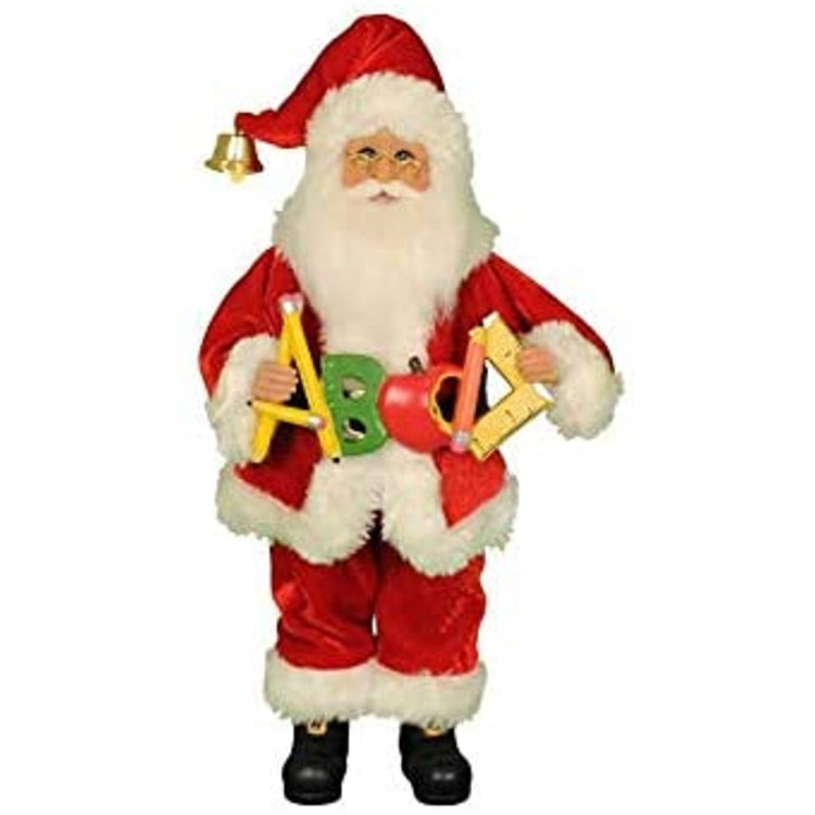 Santa in a red suit holding ABC sign