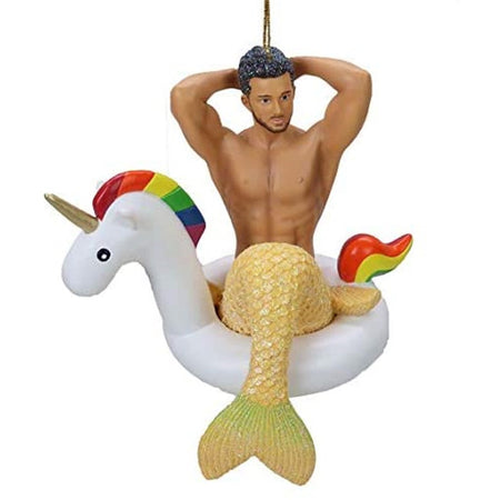 Merman figurine hanging ornament.   Wearing a yellow tail sitting in a rainbow accented unicorn floaty.