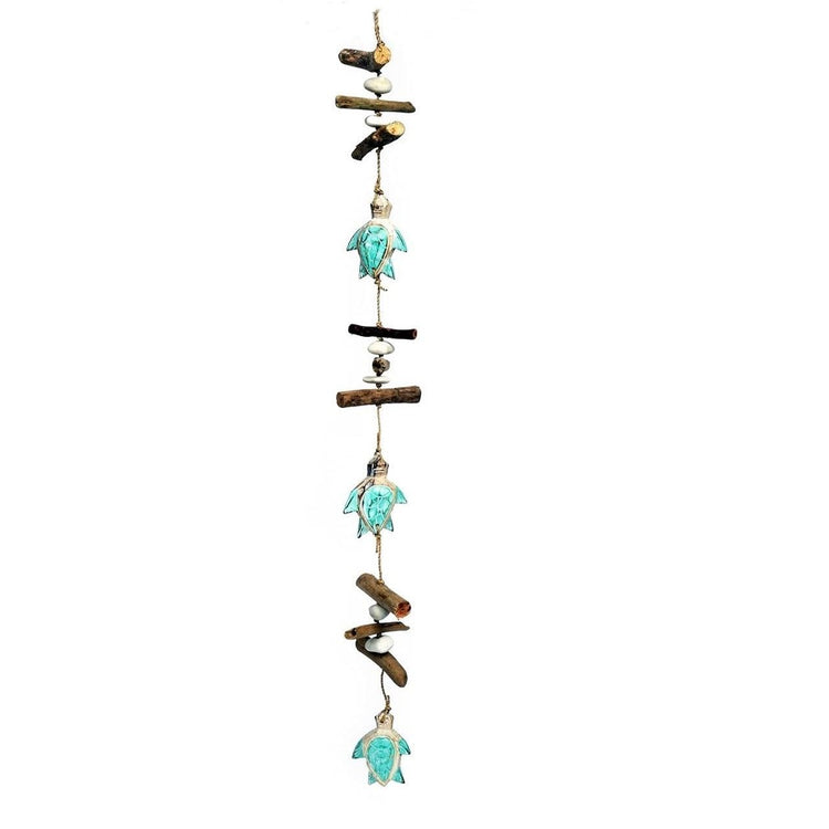 3 aqua color sea turtles with driftwood & shell pieces hanging on it.