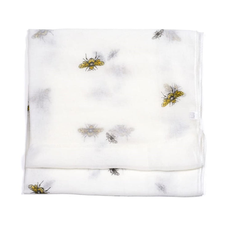 White scarf with yellow & black bumble bees scattered on it.