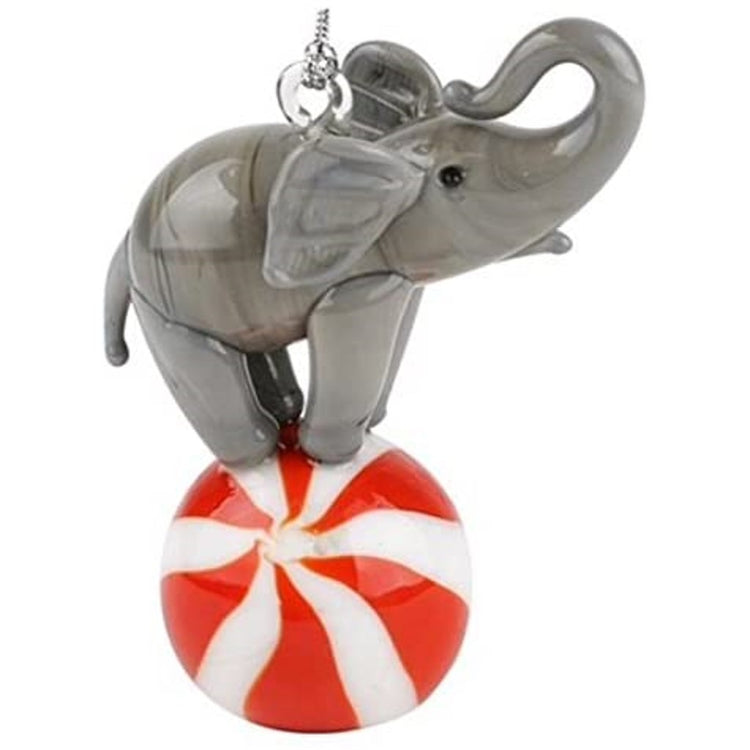 Grey elephant on a red & white ball.