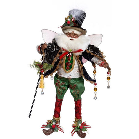 African American fairy figurine with green pants, red socks carrying a black and  white cane or candy cane