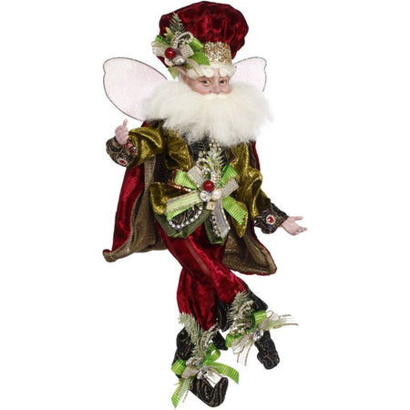 Male fairy figurine dressed in red pants w/ matching puff hat, green ribbons & white fabric wings.