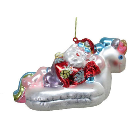 White unicorn float with Santa in a tropical shirt in it.