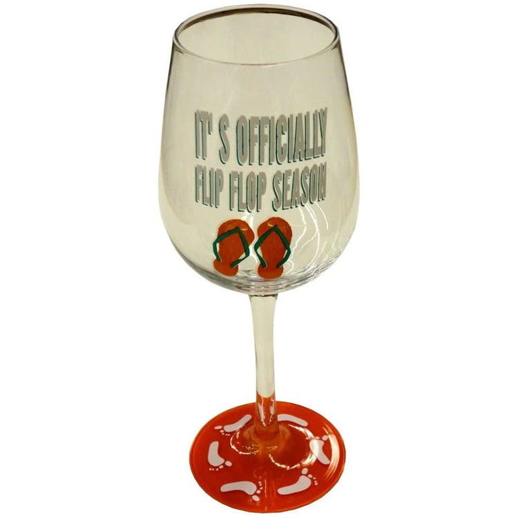 Wine glass with a red stem, flip flops & "it's officially flip flop season" on the glass