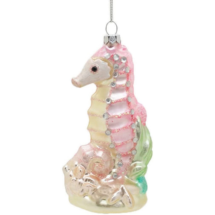 light pink seahorse with a light yellow belly and gems
